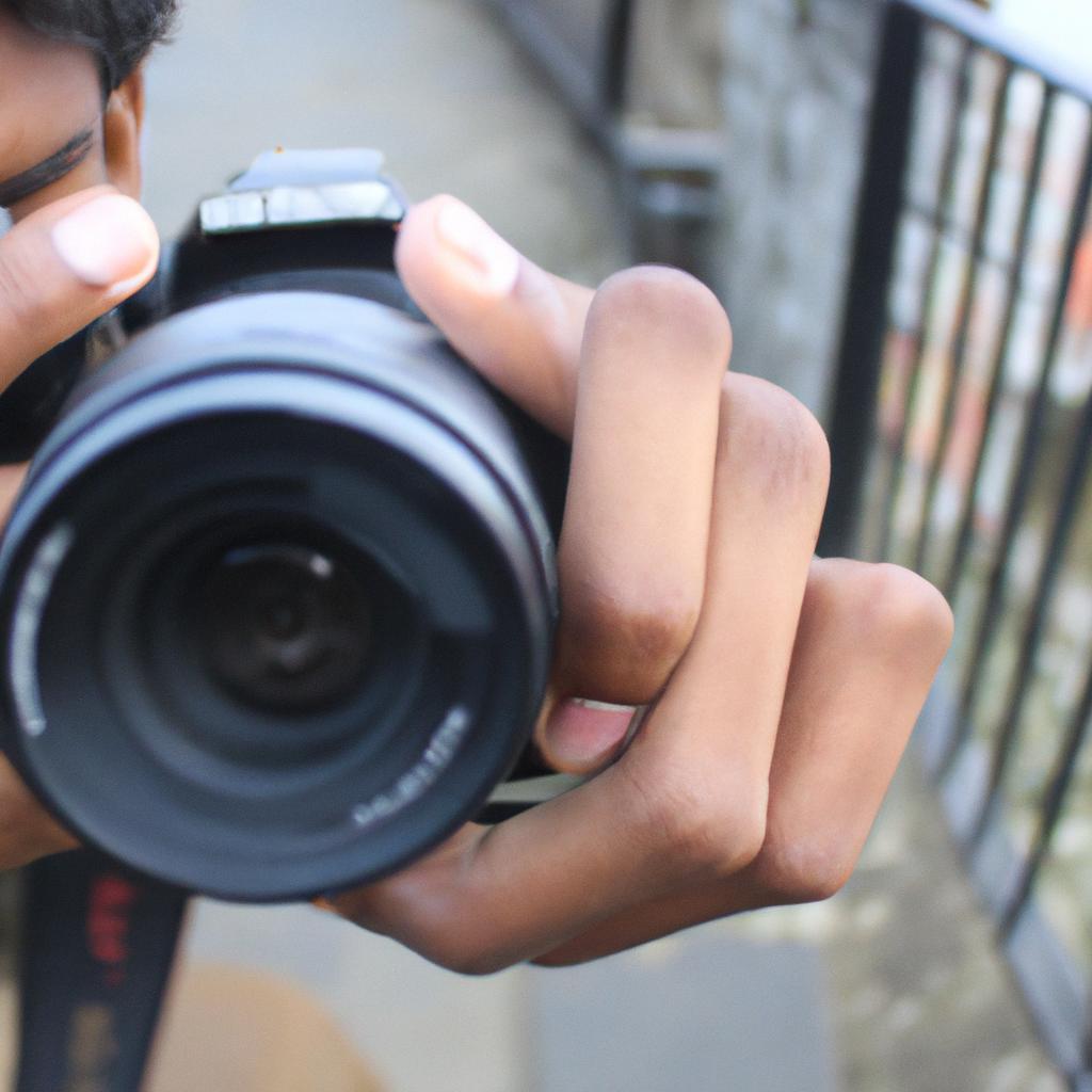 Person holding camera, capturing images